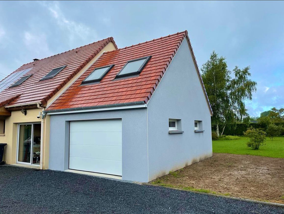 Extension de maison avec garage et combles aménagés